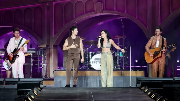Demi Lovato joins Jonas Brothers onstage at opening night of new tour